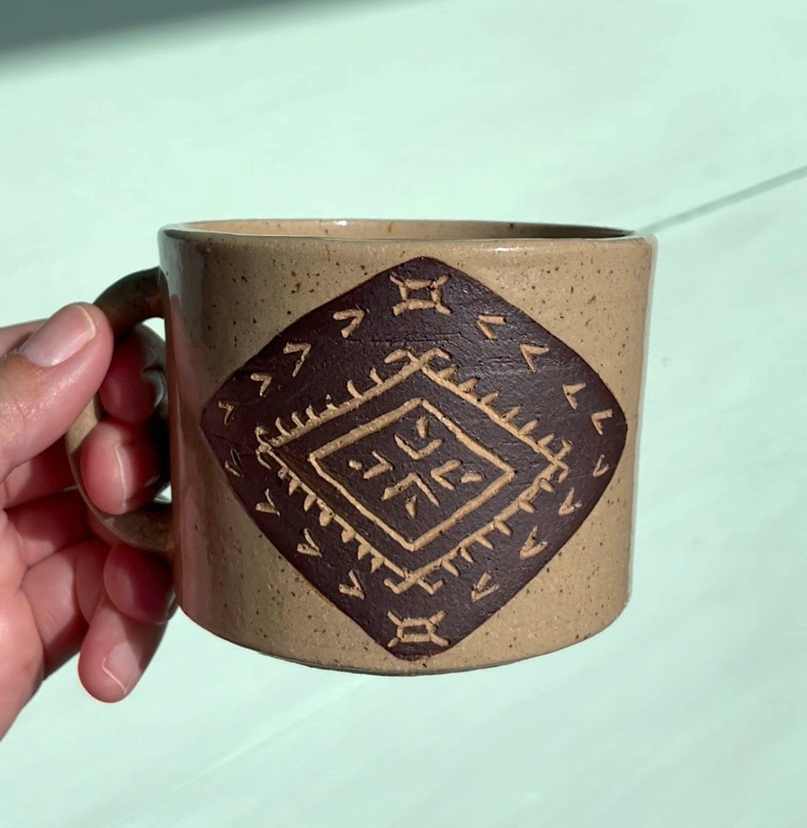 Hand Carved Ceramic Malu Mug Brown (243) by MASINA CREATIVE