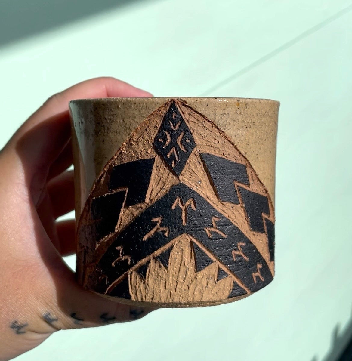 Hand Carved Ceramic Tatau Mug Brown (249) by MASINA CREATIVE