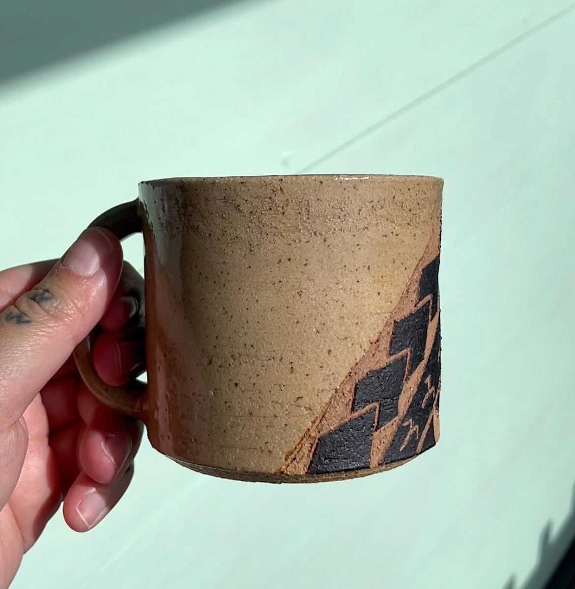 Hand Carved Ceramic Tatau Mug Brown (249) by MASINA CREATIVE
