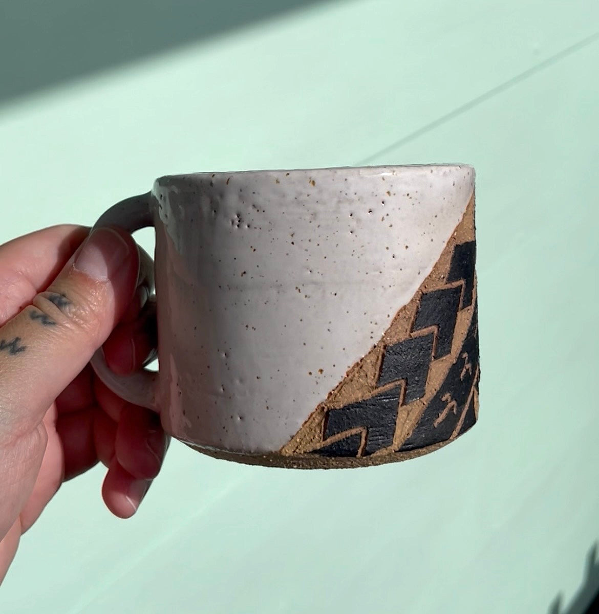 Hand Carved Ceramic Tatau Mug White (251) by MASINA CREATIVE